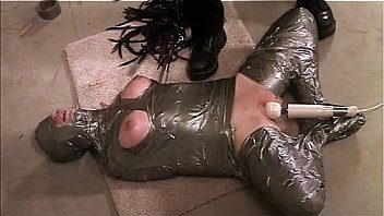 Encased mummified duct tape bondage