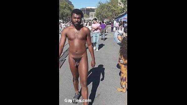 Naked black boy in street