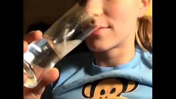 Real teen drinks a lot of cum from a glass.