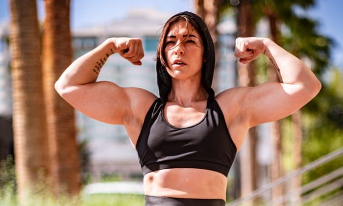 Muscled woman flex worship armwrestle
