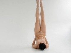 Nude gymnast twisting well shaped body